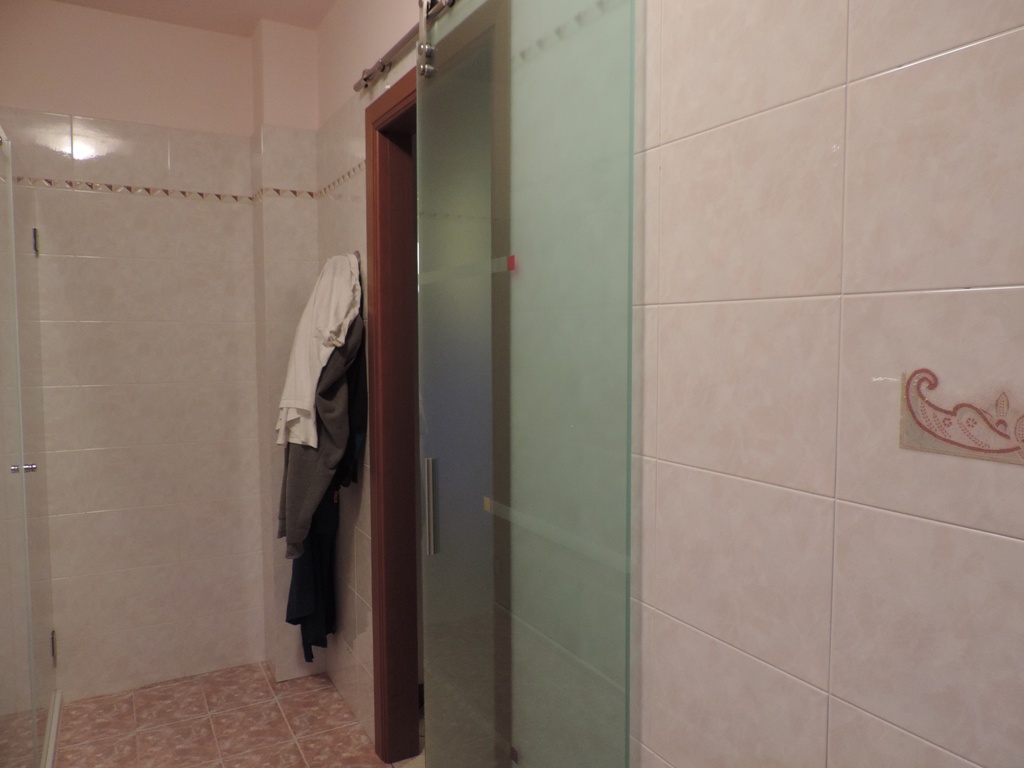 porta scorrevole in vetro