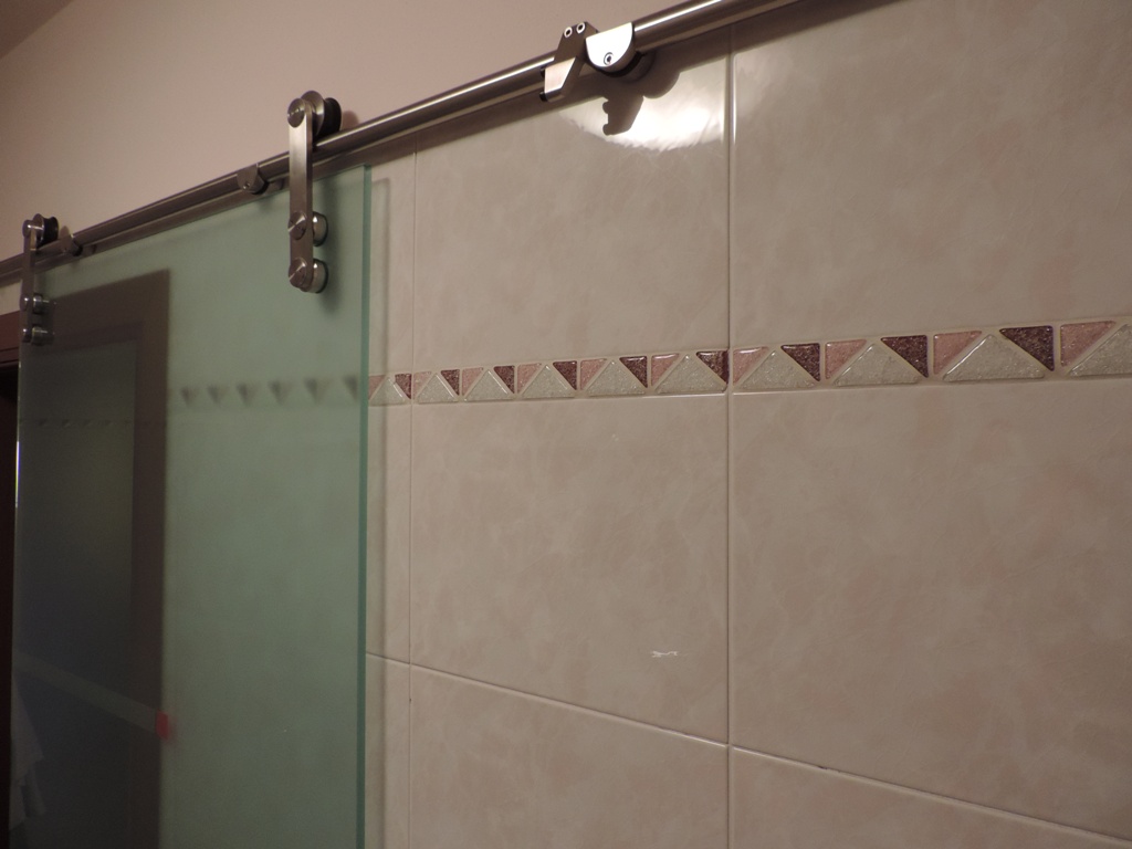 meccanismo della porta in vetro scorrevole